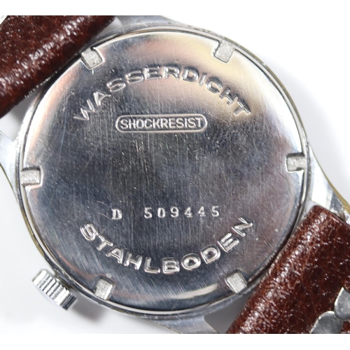 69 - D marked Selza wristwatch. Serial D 509445. Plated case with brushed finish, light wear, 33mm withou... 