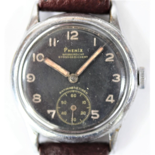 79 - DH marked Phenix wristwatch. Serial D 961 H. Bright plated case, some wear to plating, 33mm without ... 