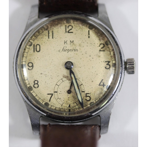 76 - KM marked Siegerin wristwatch. Serial 129207. Plated case, brushed finish, minimal plating wear, 30m... 