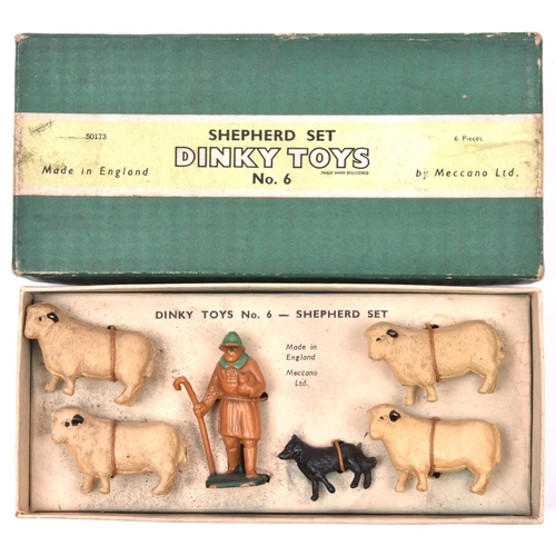 388 - A Dinky Toys Shepherd Set (No.6). Comprising Shepherd, sheepdog and 4x sheep. Boxed, minor wear. Con... 