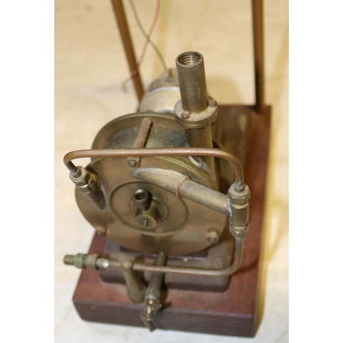 45 - A Stuart Models dynamo. Rated at 4v. 1a. and 8000rpm.  Connected to a brass steam driven fan and wir... 