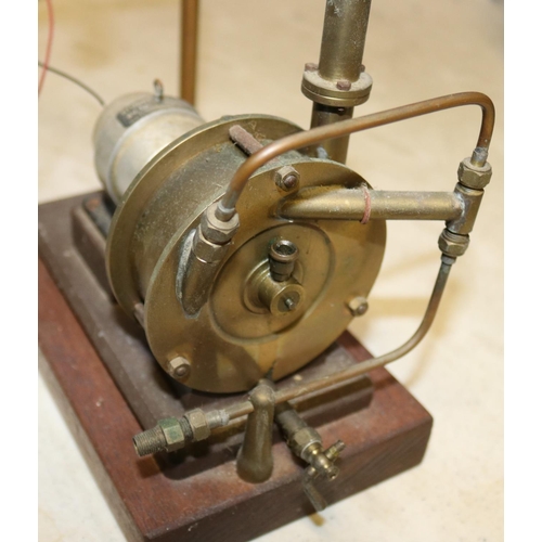 45 - A Stuart Models dynamo. Rated at 4v. 1a. and 8000rpm.  Connected to a brass steam driven fan and wir... 