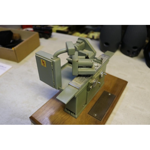 47 - A small metal model of an industrial grinding machine. A well detailed model presented as a retireme... 