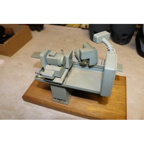 47 - A small metal model of an industrial grinding machine. A well detailed model presented as a retireme... 