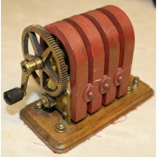 53 - A hand-cranked magneto machine of brass and copper construction with 4 permanent magnets. 'No.8' sta... 