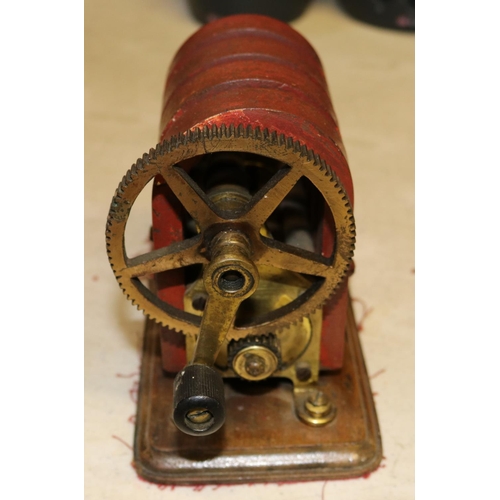 53 - A hand-cranked magneto machine of brass and copper construction with 4 permanent magnets. 'No.8' sta... 