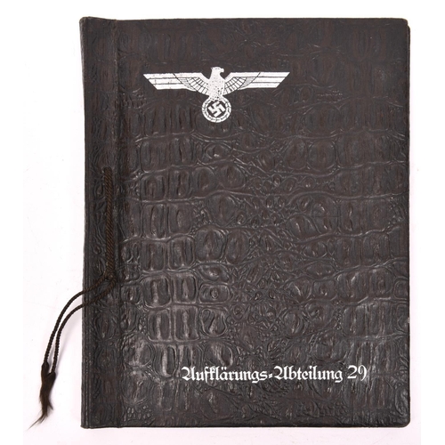 107 - A Third Reich photograph album, the cover of imitation crocodile skin, impressed with silver army ea... 