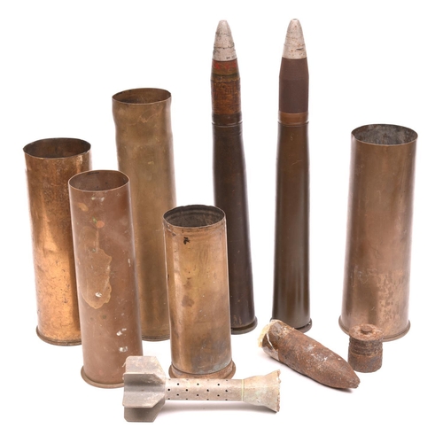 36 - A quantity of WWII shell cases comprising: 2 Drill rounds with brass cases and drill heads; a 1941 d... 