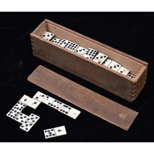 10 - A 19th Century Domino set. 49x playing pieces of bone and ebony (or ebonised wood) construction, eac... 