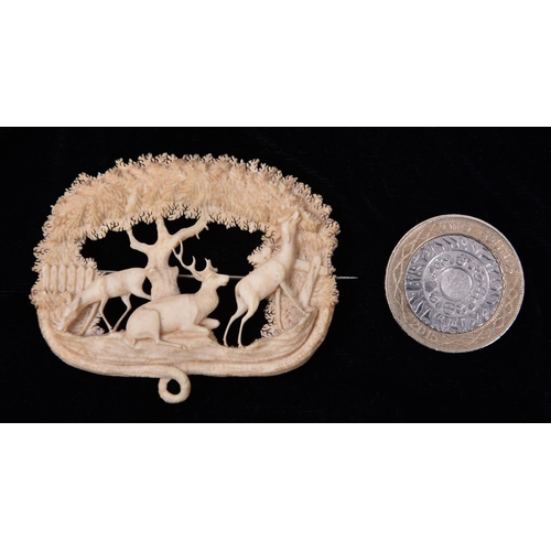 11 - A very finely worked 19th Century Victorian ivory brooch depicting a very detailed scene with three ... 