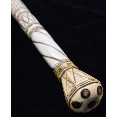 13 - A mid 19th century scrimshaw walking stick, the straight haft of finely worked narwhal tusk, with a ... 