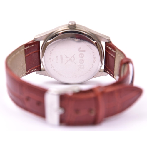 131 - A Jeep quartz watch with date display and brown leather strap. With case and instruction leaflet. Wa... 