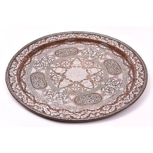 14 - A large 19th Century Cairoware tray set. Of possibly Egypt, Morocco or Syria Mamluk origin. Comprisi... 