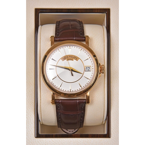 226 - A Patek Philippe, Geneve Automatic watch with automatic winding mechanism. Gold case, white metallic... 