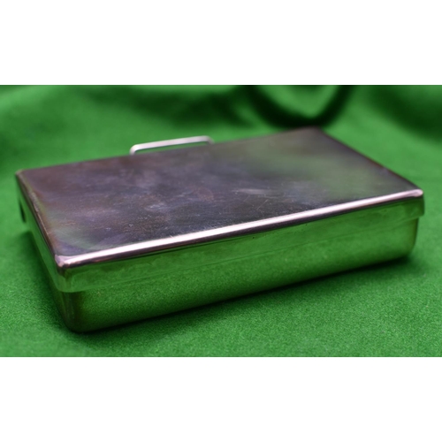 38 - A silver sandwich box of plain design. Double hinged box with carrying handle. Hallmarked Sheffield ... 