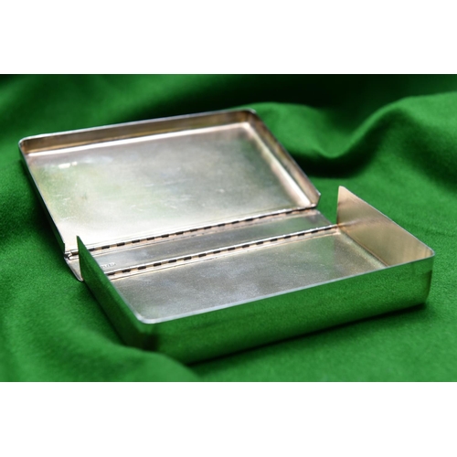 38 - A silver sandwich box of plain design. Double hinged box with carrying handle. Hallmarked Sheffield ... 