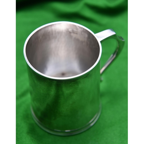 53 - A silver tankard of plain design with hammered finish to interior. Hallmarked Birmingham 1943, 'WMC'... 