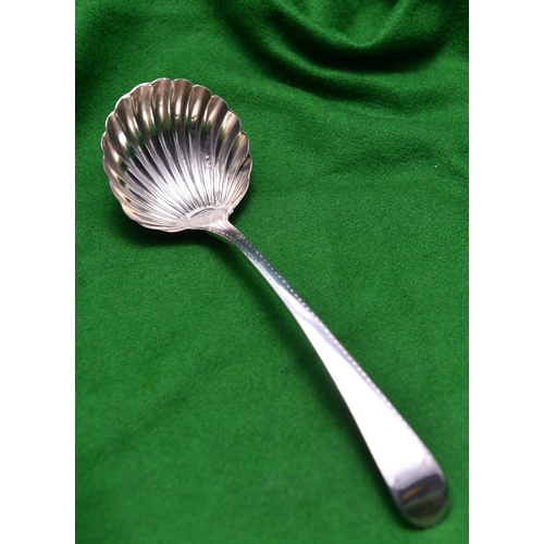 56 - A Georgian silver sauce ladle with shell shaped bowl and decorated handle. Hallmarked London 1782, '... 