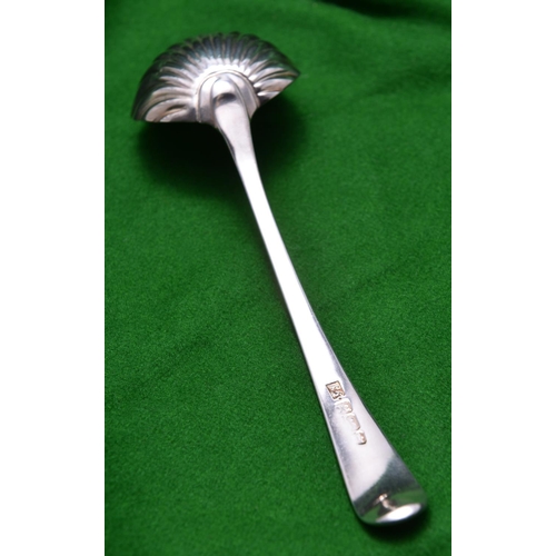 56 - A Georgian silver sauce ladle with shell shaped bowl and decorated handle. Hallmarked London 1782, '... 