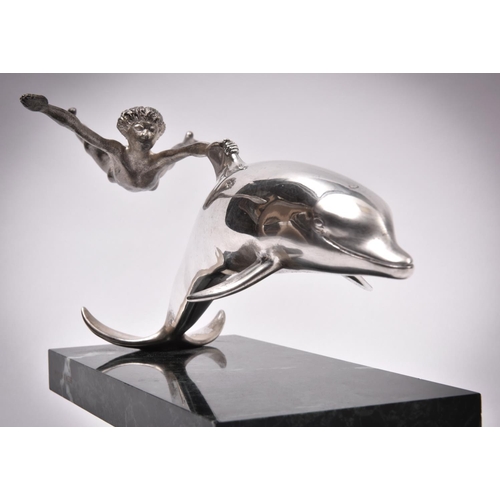 59 - A silver sculpture 'Boy With A Dolphin', London 1979 by David Wynne for Mappin and Webb. A dramatic ... 