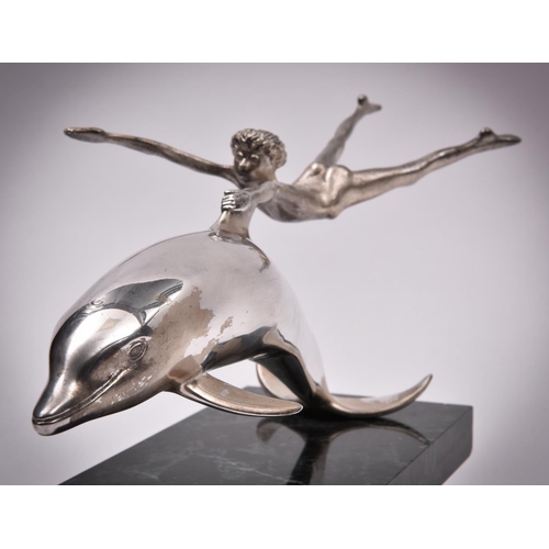 59 - A silver sculpture 'Boy With A Dolphin', London 1979 by David Wynne for Mappin and Webb. A dramatic ... 