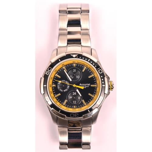 81 - An Accurist MB785 GP10 watch with quartz movement. Metallic black and yellow face with three additio... 