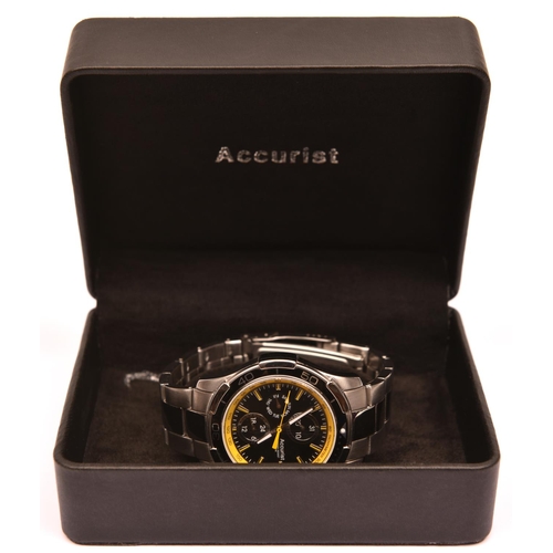 81 - An Accurist MB785 GP10 watch with quartz movement. Metallic black and yellow face with three additio... 