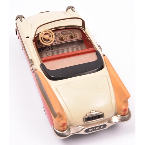 116 - Schuco Tinplate 5710 Elektro-Radio2 door open top Packard style saloon. Finished in cream, red and t... 