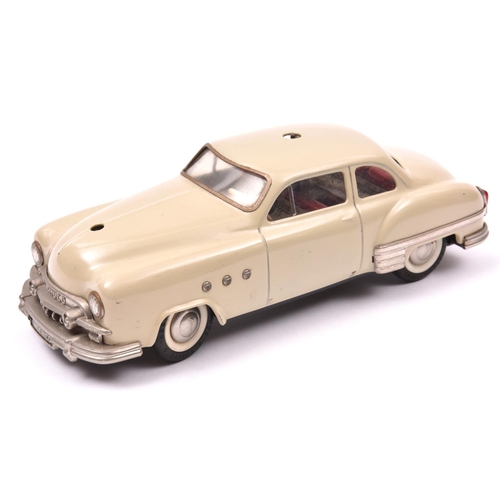 117 - Schuco - Patient-Ingenico 5311 Tinplate 2 Door Saloon. A 1950's American style car in beige with a l... 