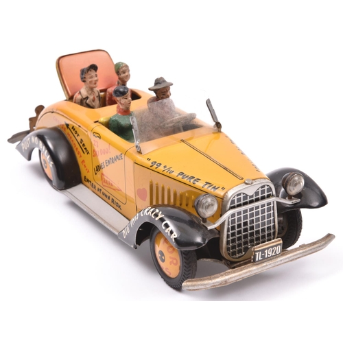 128 - A scarce Arnold Tinplate friction powered 'Tin Lizzy'. In deep yellow with black mudguards, graffiti... 