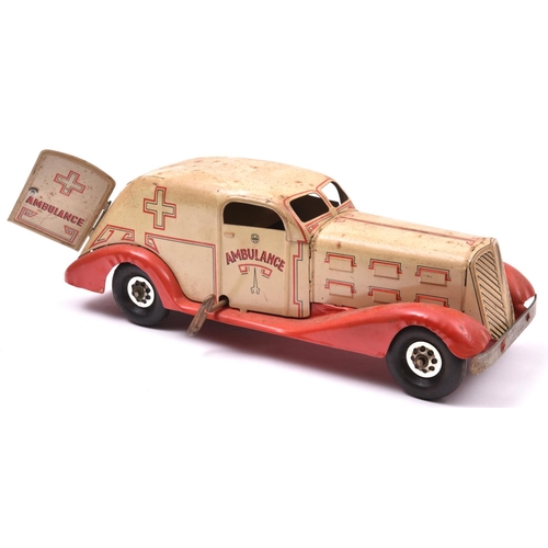 134 - An American MARX 1930's Heavy Tinplate Clockwork Ambulance. In cream with red chassis and wings, red... 