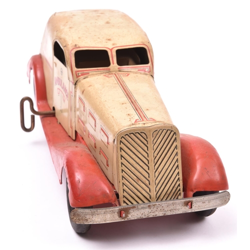 134 - An American MARX 1930's Heavy Tinplate Clockwork Ambulance. In cream with red chassis and wings, red... 