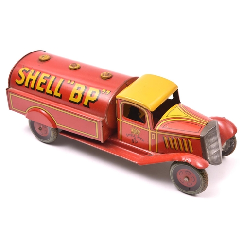 142 - A Scarce Wells Tinplate Clockwork Petrol Tank Wagon. In  red/yellow livery, with 'SHELL 'BP'' to tan... 