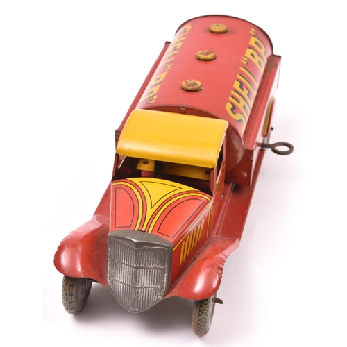 142 - A Scarce Wells Tinplate Clockwork Petrol Tank Wagon. In  red/yellow livery, with 'SHELL 'BP'' to tan... 