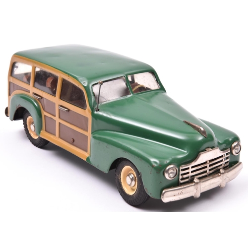 143 - An MLB (Italian) Produced Heavy Tinplate late 1940's Style Plymouth 'Woody' Station Wagon. A clockwo... 