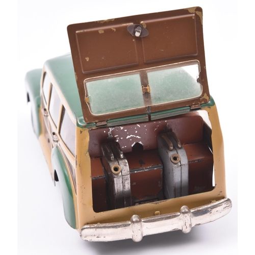 143 - An MLB (Italian) Produced Heavy Tinplate late 1940's Style Plymouth 'Woody' Station Wagon. A clockwo... 