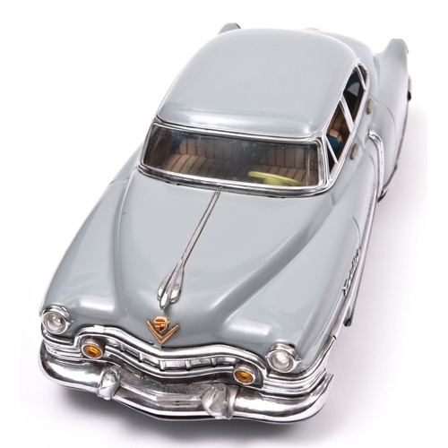 157 - An impressive Japanese Tinplate Marusan Toys Kosuge (SAN) 1953 Cadillac Fleetwood Saloon. A friction... 