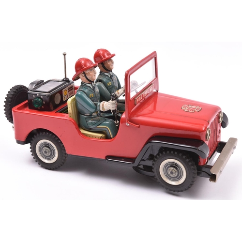 159 - A Japanese T.N. (Nomura) Tinplate Battery Powered 'Fire Dept. No.1' Jeep. A mystery action toy, fini... 