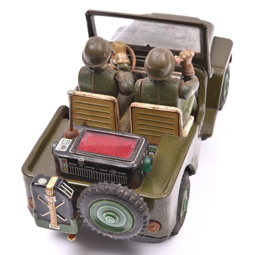 160 - A 1960's Japanese T.N. (Nomura Toys) U.S. Army Jeep. A battery powered example with 'mystery action'... 