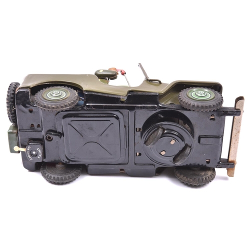 160 - A 1960's Japanese T.N. (Nomura Toys) U.S. Army Jeep. A battery powered example with 'mystery action'... 