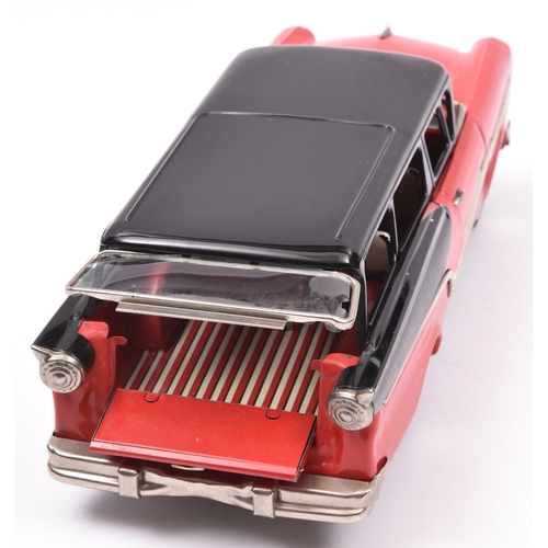 173 - Bandai Friction Powered 1957 Ford Fairlane Station Wagon. In bright red with black roof and black re... 