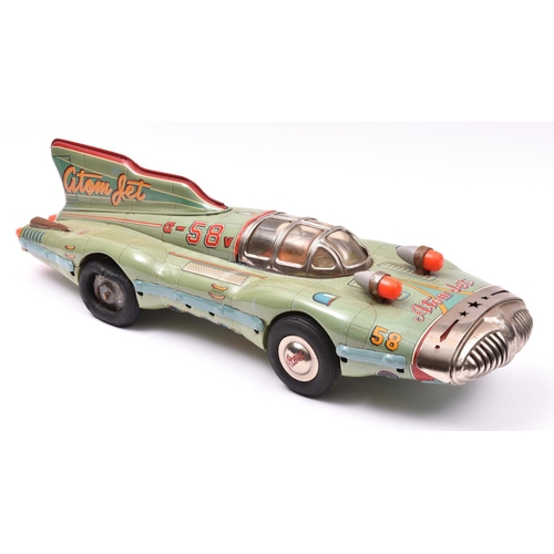 178 - A rare late 1950's Japanese Yonezawa Tinplate Atom Jet Racer. A streamlined science-fiction style sp... 