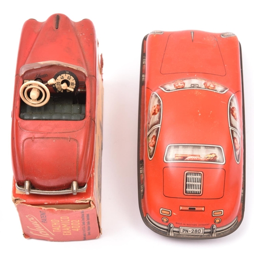 88 - 2 German Tinplate Cars. A Schuco Tach-Examico 4002 clockwork 2-door open top saloon. In red with dar... 