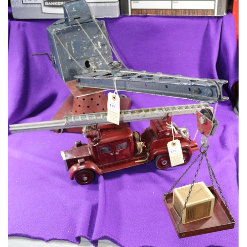 111 - A large Scale Rudimentary 3 Axle Turntable Fire Escape Fire Engine. Vehicle length 36cm, overall len... 