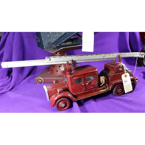 111 - A large Scale Rudimentary 3 Axle Turntable Fire Escape Fire Engine. Vehicle length 36cm, overall len... 