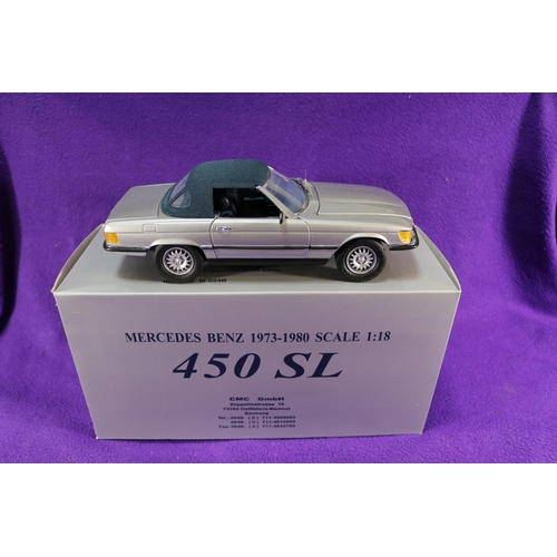 180 - A CMC 1:18 scale Mercedes-Benz 450SL. A top up example in metallic silver with dark blue roof and bl... 