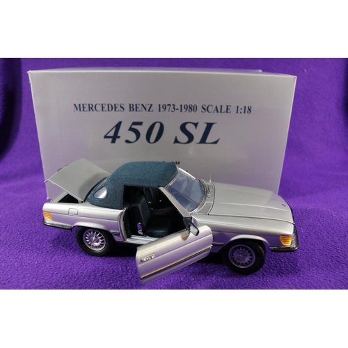 180 - A CMC 1:18 scale Mercedes-Benz 450SL. A top up example in metallic silver with dark blue roof and bl... 