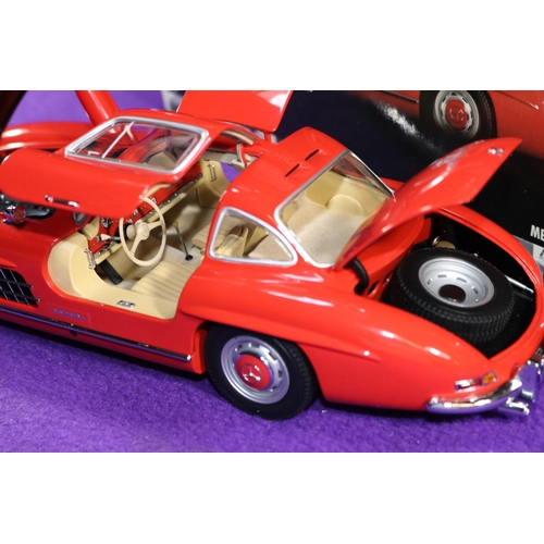 181 - Minichamps 1:18 1954 Mercedes-Benz 300SL 'Gull Wing'. An example in bright red with a tan interior, ... 