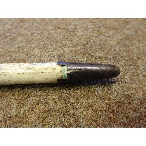 13 - A mid 19th century scrimshaw walking stick, the straight haft of finely worked narwhal tusk, with a ... 