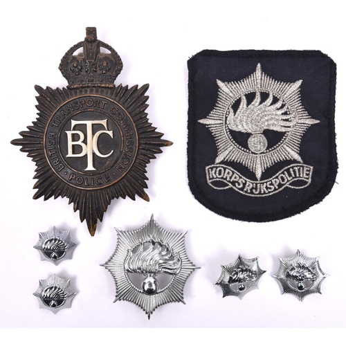 32 - A pre 1952 British Transport Commission Police helmet plate; also a pre 1993 Netherlands National Po... 